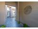 Stylish entrance features tiled floors, modern wall art, and a courtyard view at 7703 E Overlook Dr, Scottsdale, AZ 85255