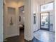Elegant foyer with a modern light fixture and views into the courtyard at 7703 E Overlook Dr, Scottsdale, AZ 85255