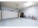 Spacious garage with a roll-up door and ample room for storage and parking vehicles at 7703 E Overlook Dr, Scottsdale, AZ 85255