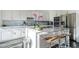 Modern kitchen with marble countertops, stainless steel appliances, and breakfast bar seating at 7703 E Overlook Dr, Scottsdale, AZ 85255