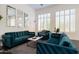 Beautiful living room featuring large windows, elegant decor, and comfortable seating at 7703 E Overlook Dr, Scottsdale, AZ 85255