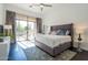 Spacious main bedroom boasts patio access and a modern design with a ceiling fan and views at 7703 E Overlook Dr, Scottsdale, AZ 85255