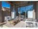 Covered patio with comfortable seating area, large sliding glass doors, and view of the interior at 7703 E Overlook Dr, Scottsdale, AZ 85255