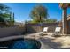 Relaxing backyard pool area featuring two lounge chairs perfect for soaking up the sun at 7703 E Overlook Dr, Scottsdale, AZ 85255