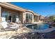 Backyard with lounge seating and pool featuring a rock waterfall feature at 7703 E Overlook Dr, Scottsdale, AZ 85255