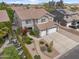 Aerial view of home, landscaping, three-car garage, and neighborhood at 824 E Chelsea Dr, San Tan Valley, AZ 85140