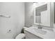 Neat bathroom includes a white vanity, a framed mirror, and new hardware at 824 E Chelsea Dr, San Tan Valley, AZ 85140