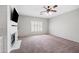 Bonus room features a fireplace, plantation shutters, and carpeting at 824 E Chelsea Dr, San Tan Valley, AZ 85140