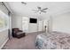 Main bedroom boasts a carpeted floor, chair, and ensuite bathroom at 824 E Chelsea Dr, San Tan Valley, AZ 85140