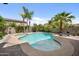 Backyard pool area with brick and concrete, palm trees, vegetation, and lounge chair; great spot at 824 E Chelsea Dr, San Tan Valley, AZ 85140