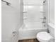 Clean bathroom features a shower-tub combination, white toilet, and basic fixtures at 8711 N 67Th Dr, Peoria, AZ 85345