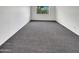 Spacious bedroom with gray carpet, bright window and clean neutral walls at 8711 N 67Th Dr, Peoria, AZ 85345