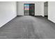 Bedroom with carpet floors, sliding glass doors, and white walls at 8711 N 67Th Dr, Peoria, AZ 85345