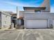 Two-story home with desert landscaping, a one-car garage, and private balcony at 8711 N 67Th Dr, Peoria, AZ 85345