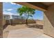 Large backyard featuring a brick patio and mature trees at 10245 W Parkway Dr, Tolleson, AZ 85353