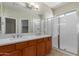 The bathroom features double sinks, updated counter tops, and an open shower at 10245 W Parkway Dr, Tolleson, AZ 85353
