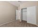 Bedroom featuring a ceiling fan, carpet, and closet space at 10245 W Parkway Dr, Tolleson, AZ 85353