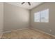 This bedroom features a ceiling fan and tiled floors at 10245 W Parkway Dr, Tolleson, AZ 85353