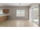 Dining area with tile floors, modern lighting, and sliding glass door for seamless indoor-outdoor living at 10245 W Parkway Dr, Tolleson, AZ 85353