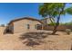 Exterior rear view shows a one-story house and desert landscaping at 10245 W Parkway Dr, Tolleson, AZ 85353