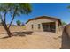 Back of the house boasts a patio with desert landscaping at 10245 W Parkway Dr, Tolleson, AZ 85353