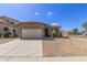 Inviting single-Gathering home with a two-car garage, desert landscaping, and concrete driveway at 10245 W Parkway Dr, Tolleson, AZ 85353