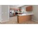 Well-appointed kitchen with stainless steel appliances, ample cabinet space, and a practical breakfast bar at 10245 W Parkway Dr, Tolleson, AZ 85353
