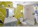 Modern bathroom showcases a vanity, toilet, shower-tub combo, and creative patterned wall at 1111 W University Dr # 2012, Tempe, AZ 85281
