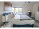 Comfortable bedroom boasts a plush bed, side tables with lamps, and a patio view at 1111 W University Dr # 2012, Tempe, AZ 85281
