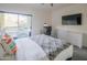 Inviting bedroom with a plush bed, desk, TV, and private balcony access at 1111 W University Dr # 2012, Tempe, AZ 85281