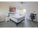 Bright bedroom features a comfortable bed, ceiling fan, and sliding glass doors to the outdoor patio at 1111 W University Dr # 2012, Tempe, AZ 85281