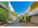Scenic courtyard with lush landscaping, and colorful modern building exteriors at 1111 W University Dr # 2012, Tempe, AZ 85281