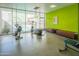 Bright gym with exercise equipment, natural light, and views of the outdoors, contributing to a healthy lifestyle at 1111 W University Dr # 2012, Tempe, AZ 85281