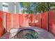 Relaxing hot tub enclosed with a unique red barrier with silver supports that provide privacy and style at 1111 W University Dr # 2012, Tempe, AZ 85281