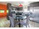 Modern kitchen with gray cabinets, stainless steel appliances, and a dining area at 1111 W University Dr # 2012, Tempe, AZ 85281