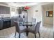 Well-equipped kitchen with gray cabinets, stainless steel appliances, and an adjacent dining area at 1111 W University Dr # 2012, Tempe, AZ 85281