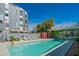 Community pool with lounge chairs for residents to relax in the sun at 1111 W University Dr # 2012, Tempe, AZ 85281