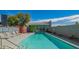 Beautiful community pool with sun loungers and shallow end caution in a modern designed gated space at 1111 W University Dr # 2012, Tempe, AZ 85281