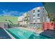 Beautiful community pool with lounge chairs and modern architecture in the background at 1111 W University Dr # 2012, Tempe, AZ 85281