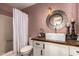 Cozy bathroom featuring framed round mirror, tile floor, and shower with curtain at 1153 W Mesquite St, Chandler, AZ 85224