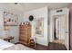 Inviting bedroom with soft lighting, wood floors, and ample closet space at 1153 W Mesquite St, Chandler, AZ 85224