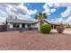 Beautiful house featuring desert landscaping, green bushes, and gray accent paint at 1153 W Mesquite St, Chandler, AZ 85224