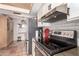 Bright kitchen with stainless steel appliances and wood cabinets provides ample storage space at 1153 W Mesquite St, Chandler, AZ 85224