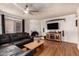 Cozy living room with brick fireplace, beamed ceiling, and lots of light at 1153 W Mesquite St, Chandler, AZ 85224