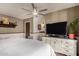Large main bedroom with wood floors, ceiling fan, and ensuite bathroom at 1153 W Mesquite St, Chandler, AZ 85224
