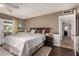 Comfortable main bedroom with wood flooring and access to the backyard at 1153 W Mesquite St, Chandler, AZ 85224