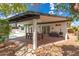 The spacious covered patio is equipped with a dining table and chairs, offering a relaxed outdoor living space at 1153 W Mesquite St, Chandler, AZ 85224