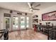 Sun room showcasing terracotta floors, bar nook, and pool views at 1153 W Mesquite St, Chandler, AZ 85224