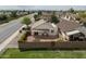 Aerial view of the home's fenced backyard featuring gravel, plants and covered seating area at 1200 W Boxelder Cir, Chandler, AZ 85224