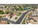 Aerial view of the home featuring manicured landscaping, sparkling pool and convenient street access at 1200 W Boxelder Cir, Chandler, AZ 85224